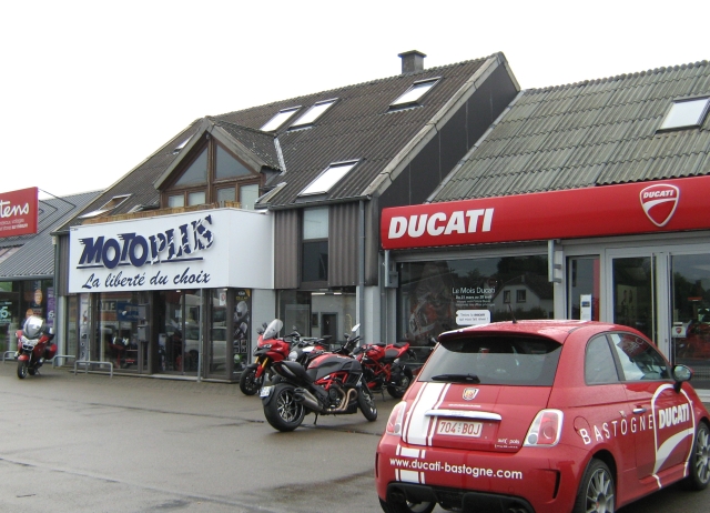 a ducati and motorcycle clothing shop in bastogne in the rain